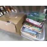A box and a stack of cookery books and wine tasting guides