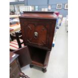 36 (2045RR) - A late 19th century mahogany cabinet of tapering form, the top door with a brass