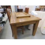 An oak extending dining table, plus 2 chairs
