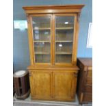 Glazed oak double door bookcase with cupboard base under