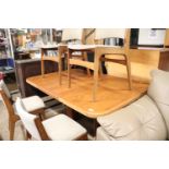 Mid century Danish teak extending dining table and 4 similar chairs with spotted upholstered seats