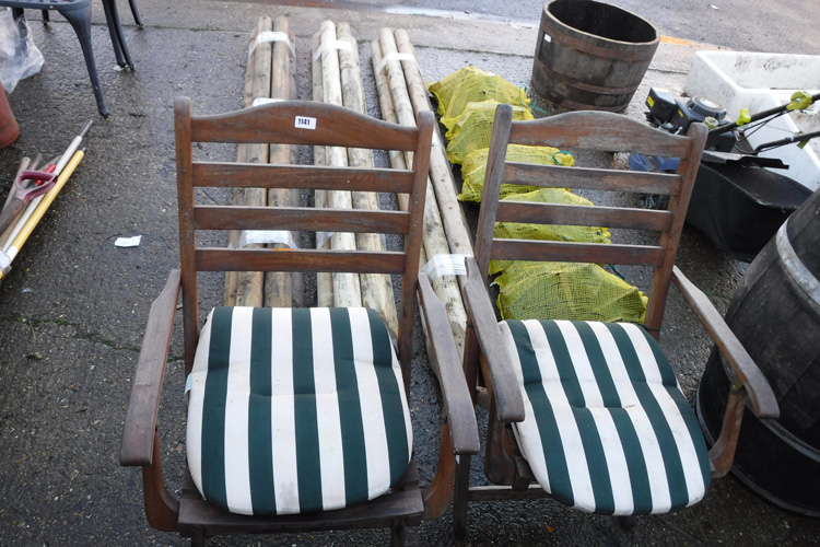Pair of teak folding garden armchairs with striped cushions