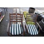 Pair of teak folding garden armchairs with striped cushions