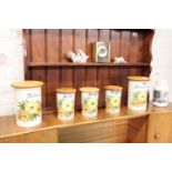 Selection of Crown Devon canisters with wooden lids, further canister, 2 ornamental babies and