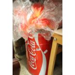 Coca-Cola tin containing artificial plants