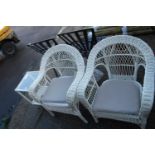 White wicker garden set comprising 2 armchairs and matching glass coffee table