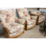Ercol wooden framed lounge suite with loose floral cushions