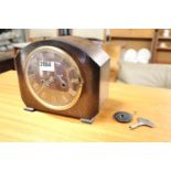 Small oak cased mantle clock with key and pendulum