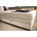 Double divan bed with bow stress mattress