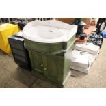 Decorative basin with cupboards underneath