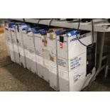 Under bay and tabletop containing approx. 15 Pro Elec oil filled heaters (some boxed)