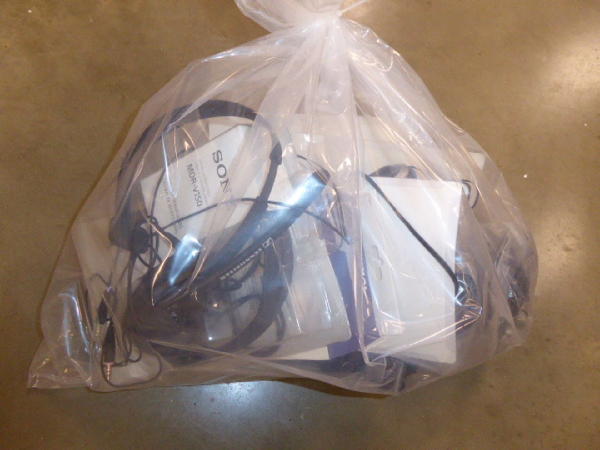 Bag containing various loose operators headsets including Pro signal wireless headphones boxed