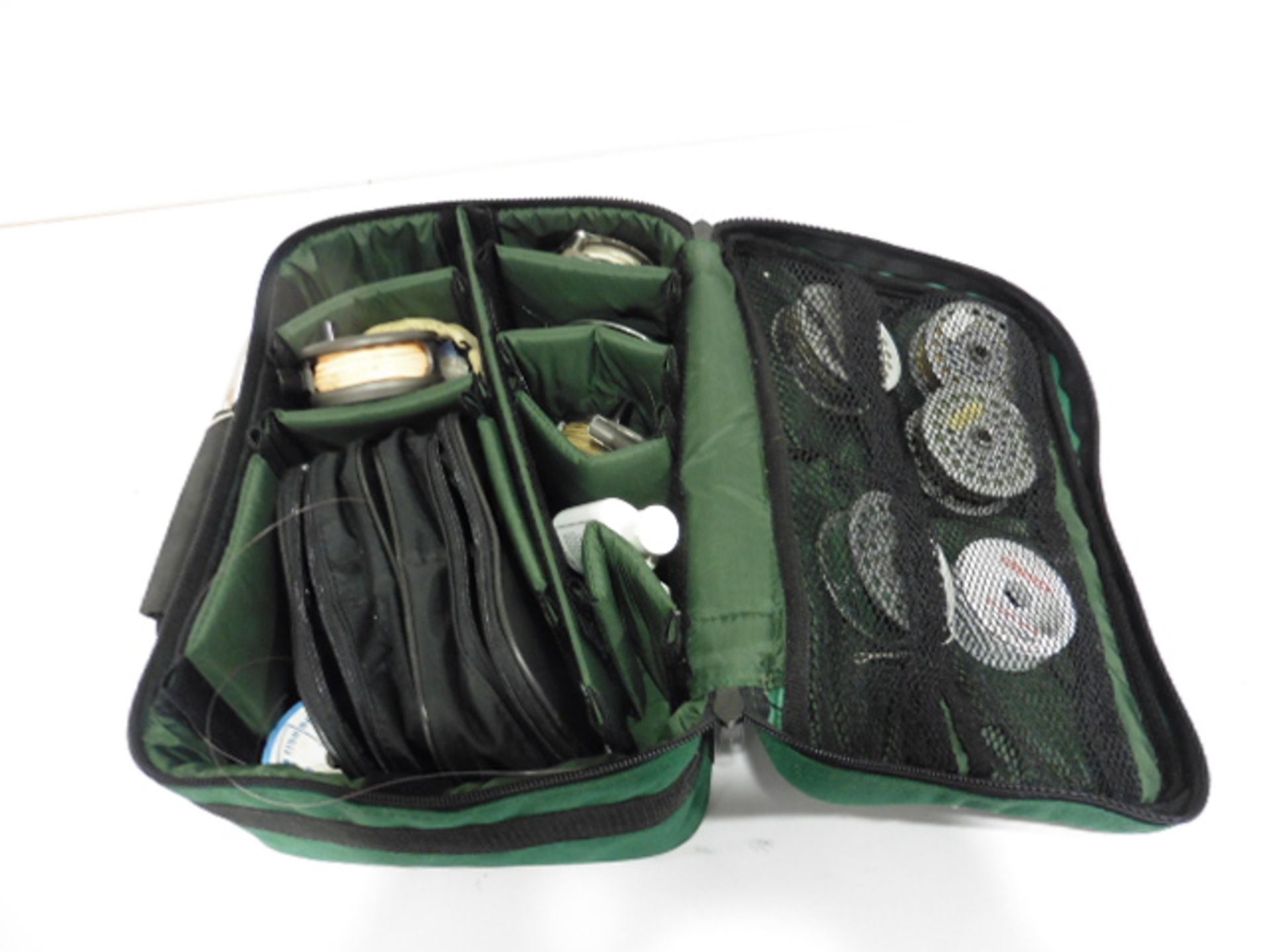 Daiwa Alltmor case with contents of Fly fishing reels, spare spools, line etc