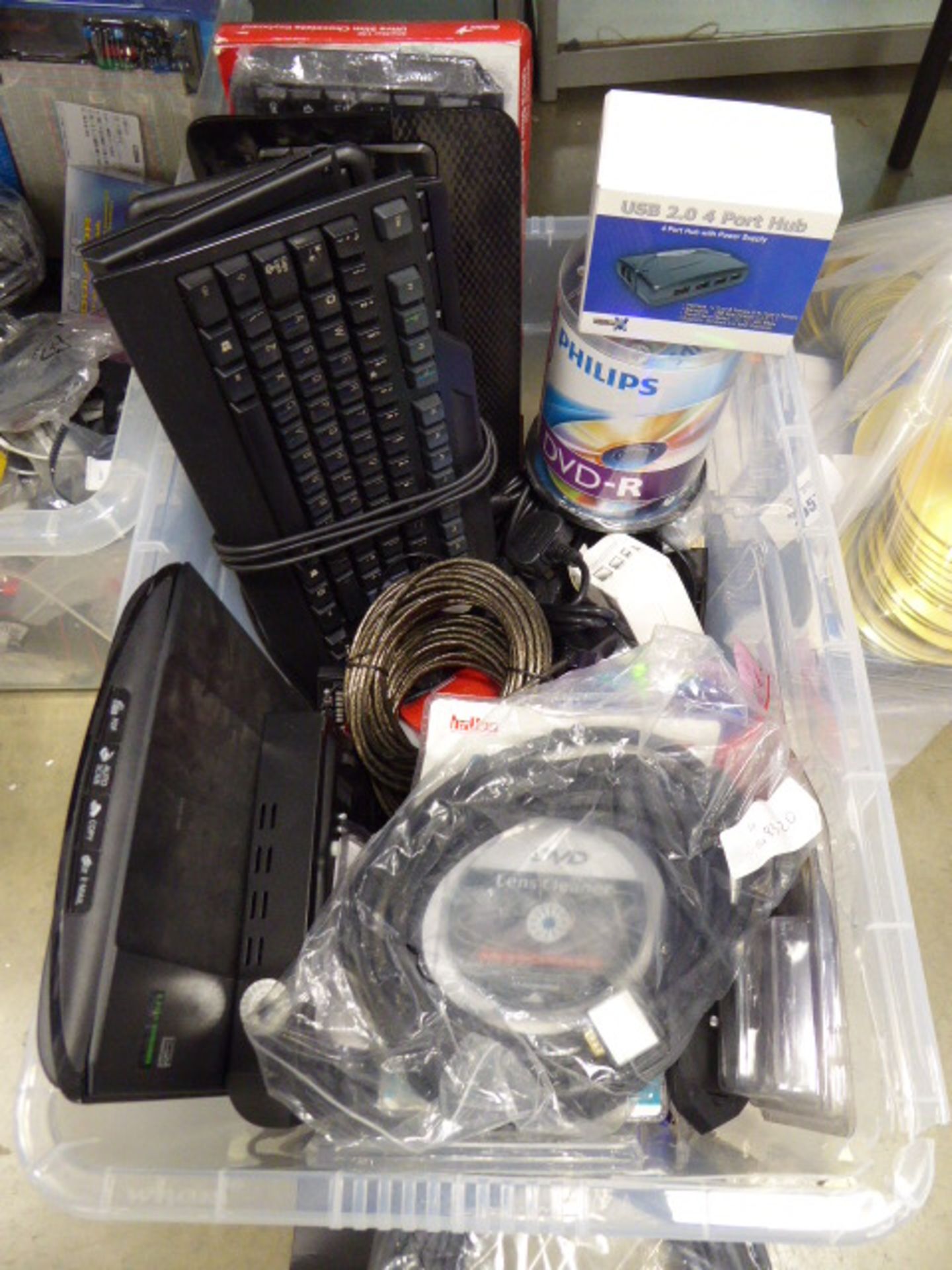 Box containing various PC keyboards, scanner, audio visual cables, HDMi VGA, DVD re writable discs