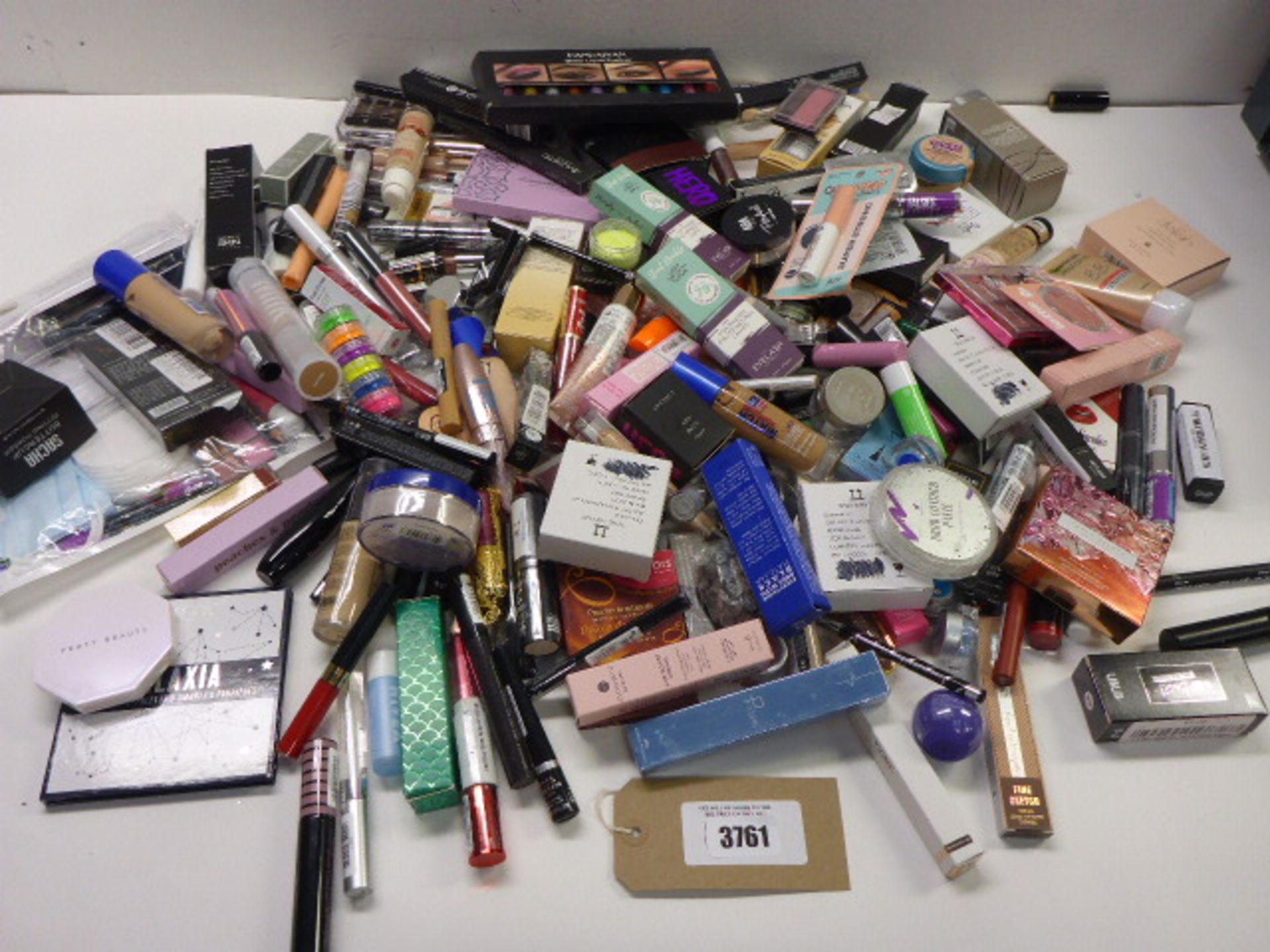 Large selection of assorted cosmetics including Fenty, Technic, Too Faced, Rimmel, Max Factor and