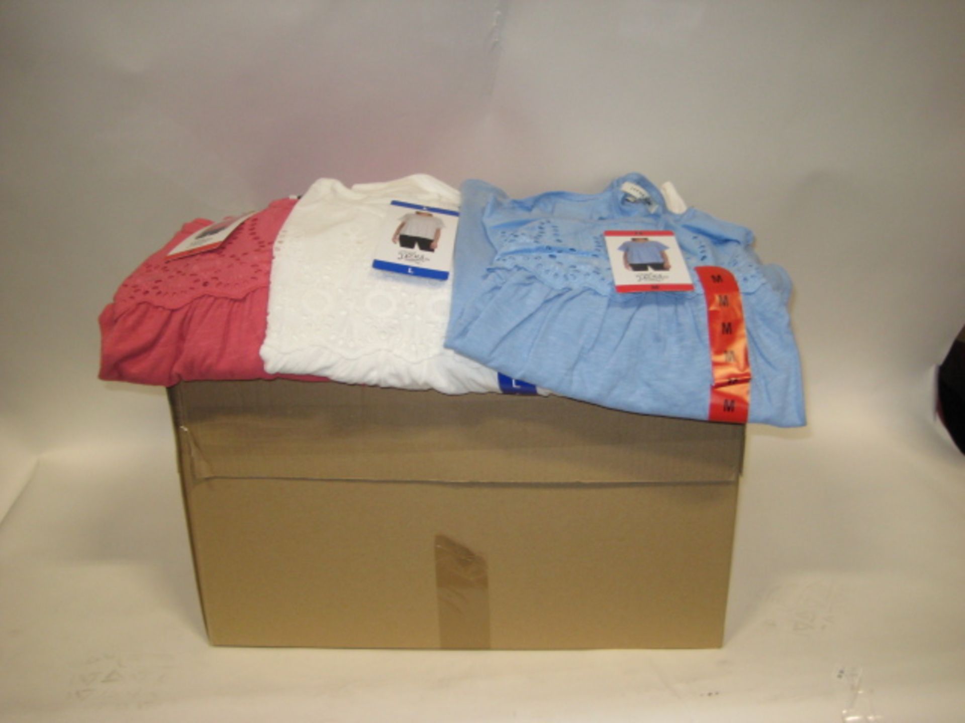 Box containing approximately 60 Jack New York ladies blouses in pink, white and light blue