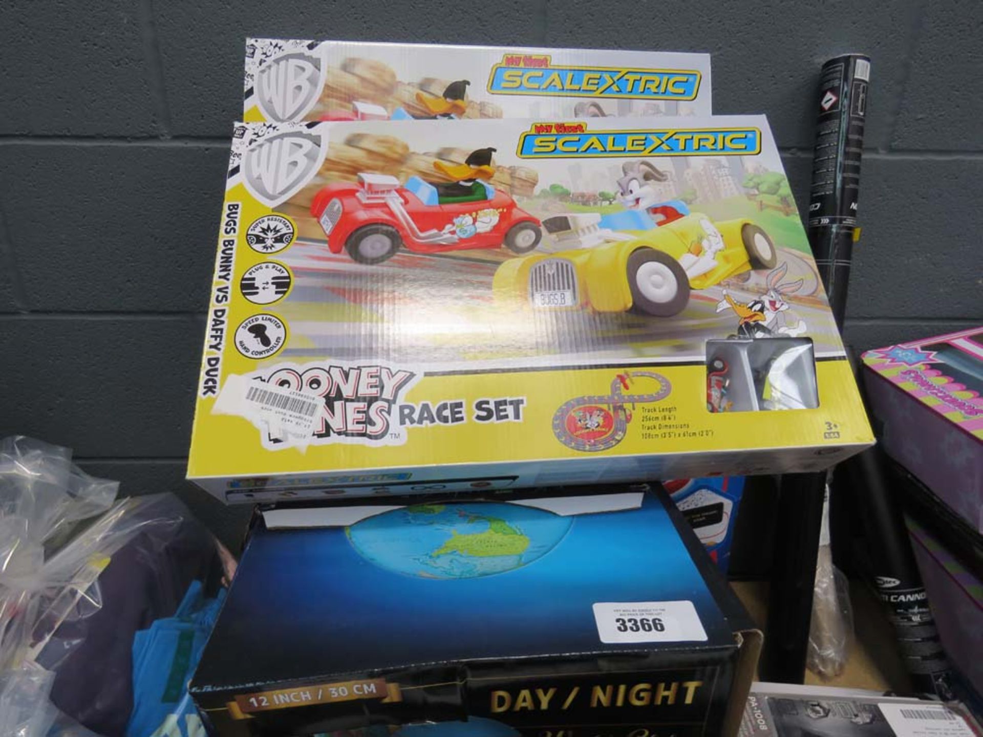 Day and Night globe, Paw Patrol toy set and 2 x Loony Tunes My First Scalextric sets