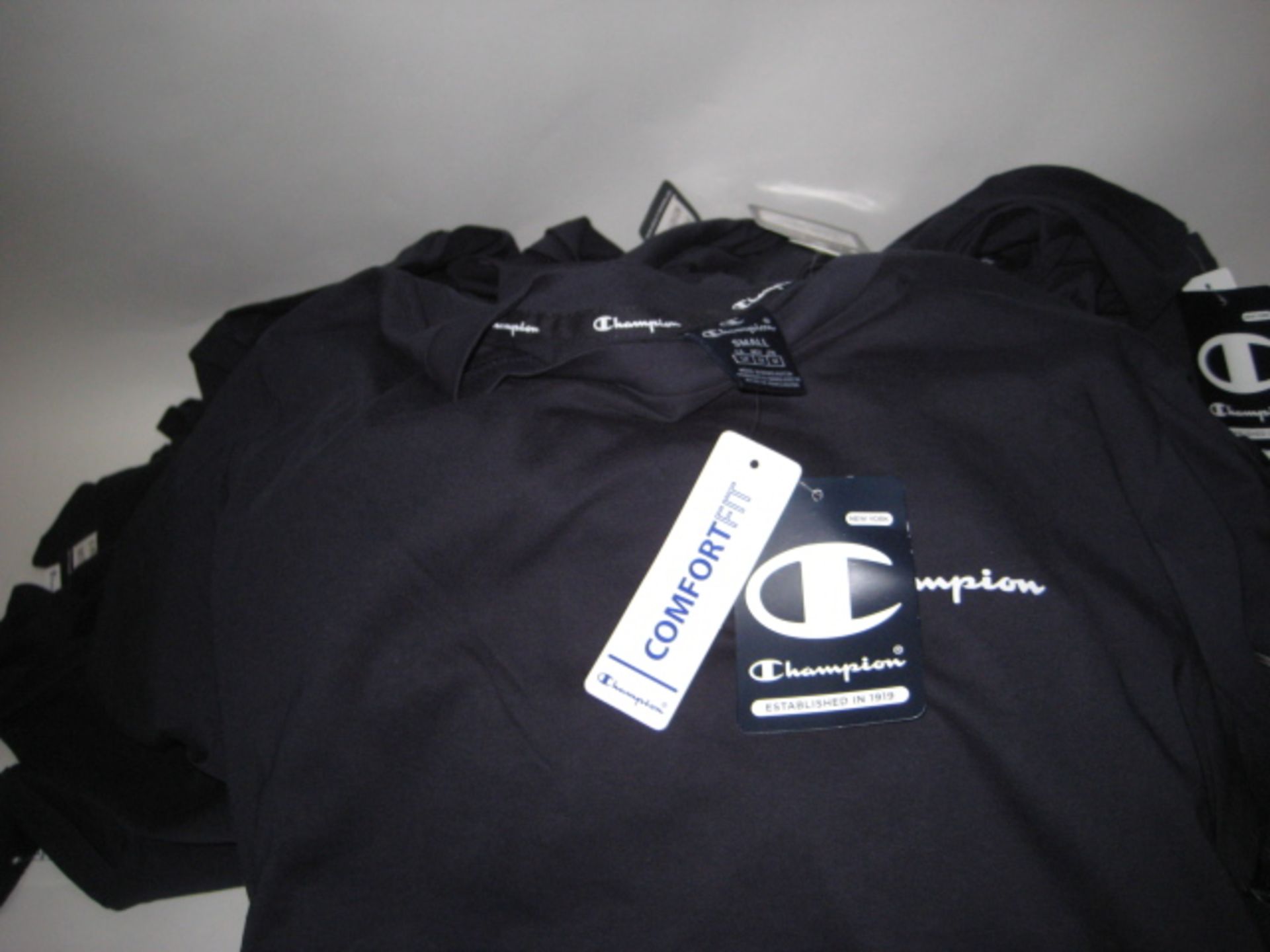 Box of 30 Champion T-shirts in dark blue various sizes prominently Small - Image 2 of 2