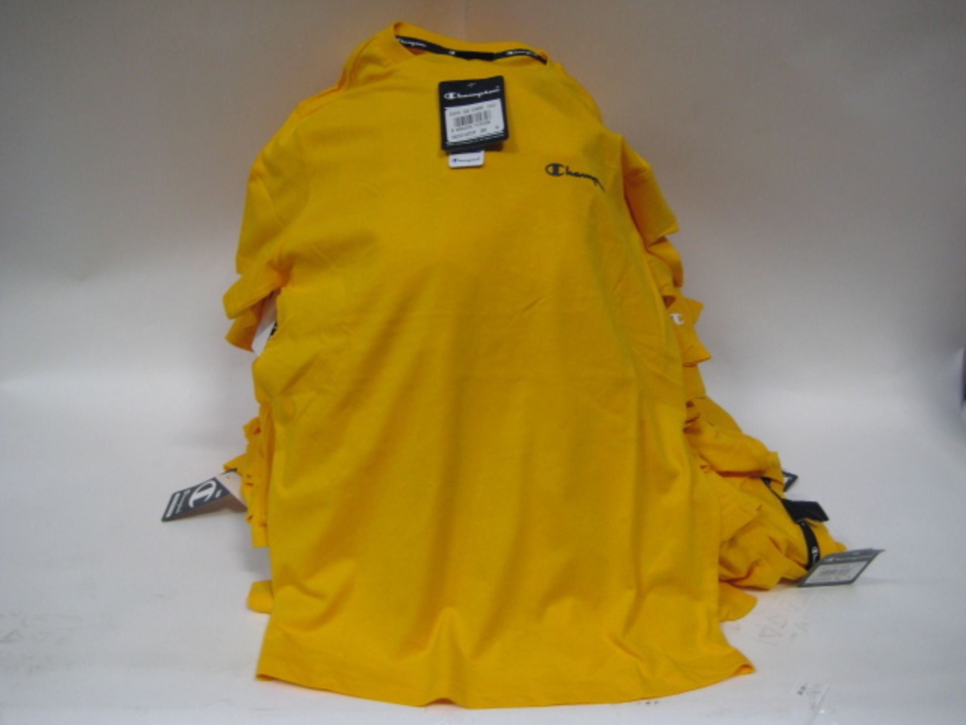 Box containing 65 Champion yellow T-shirts sizes predominately small