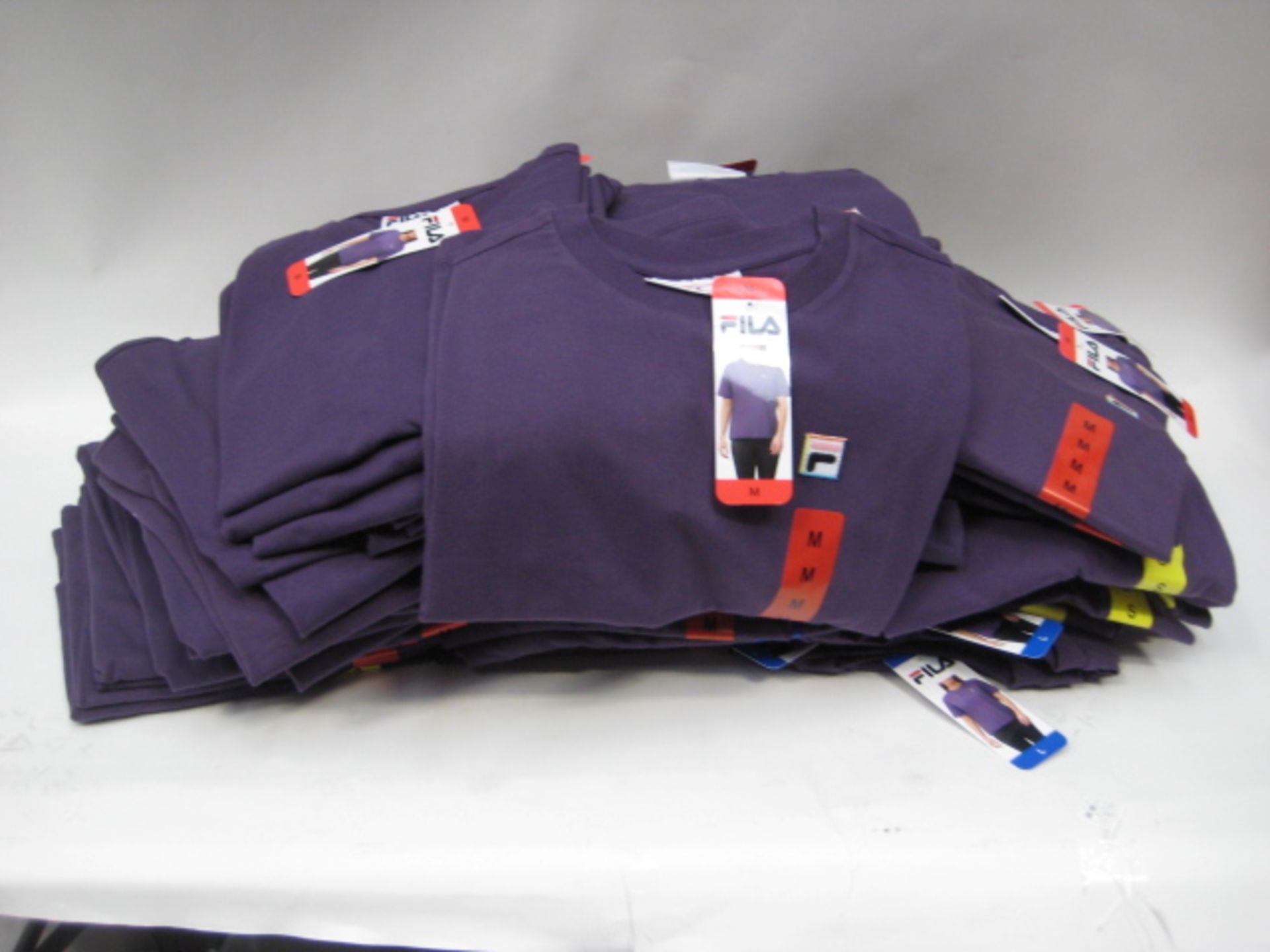 Box containing 70 Fila t-shirts in gothic grape colour