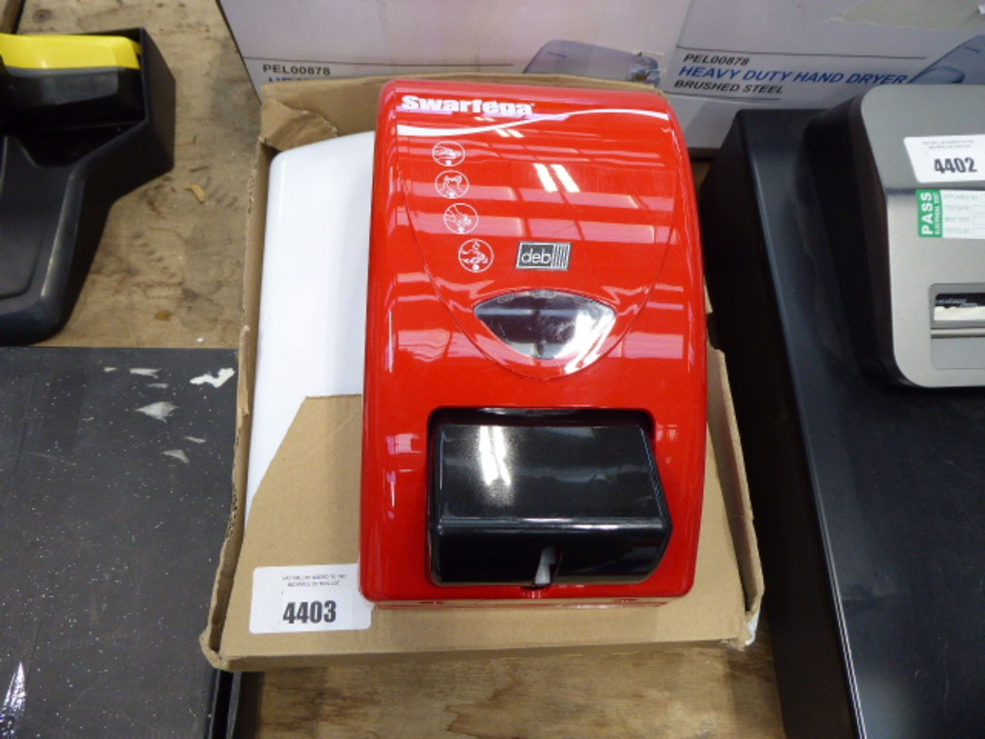 Towel dispenser and a soap dispenser