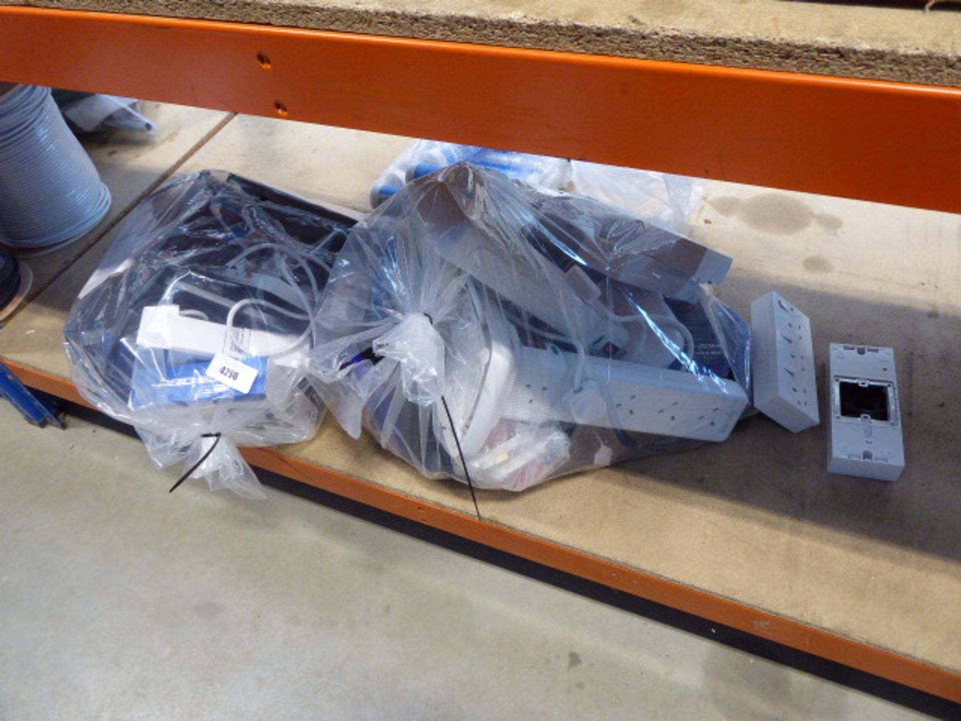 2 bags containing sockets, socket blocks, extension cables, lights, etc