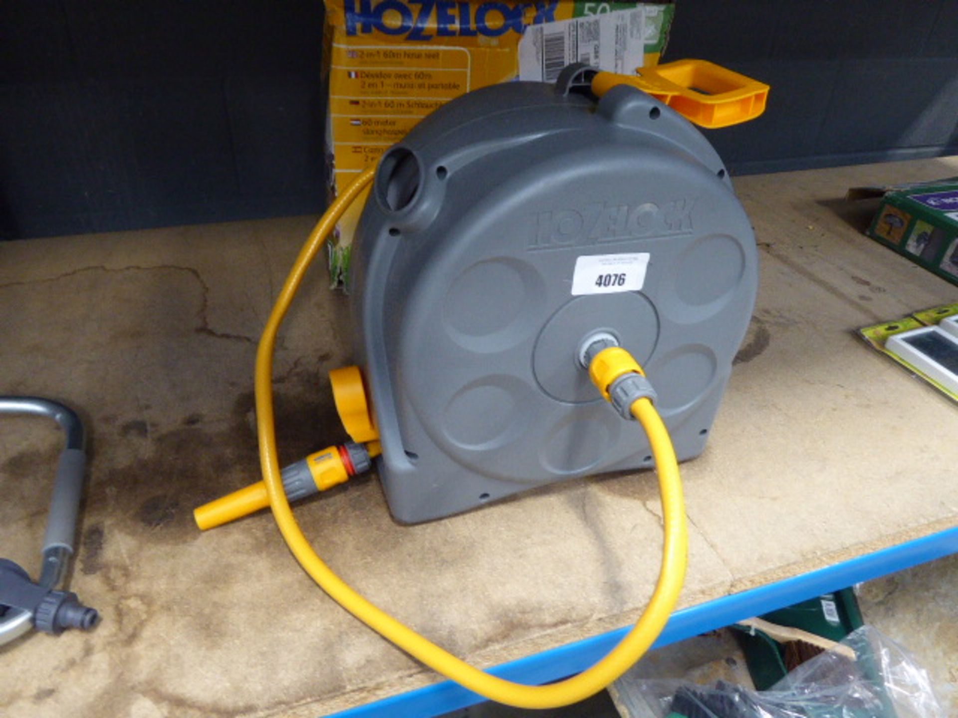 1 Hozelock hose reel (flatpack) and a Hozelock hose reel and hose