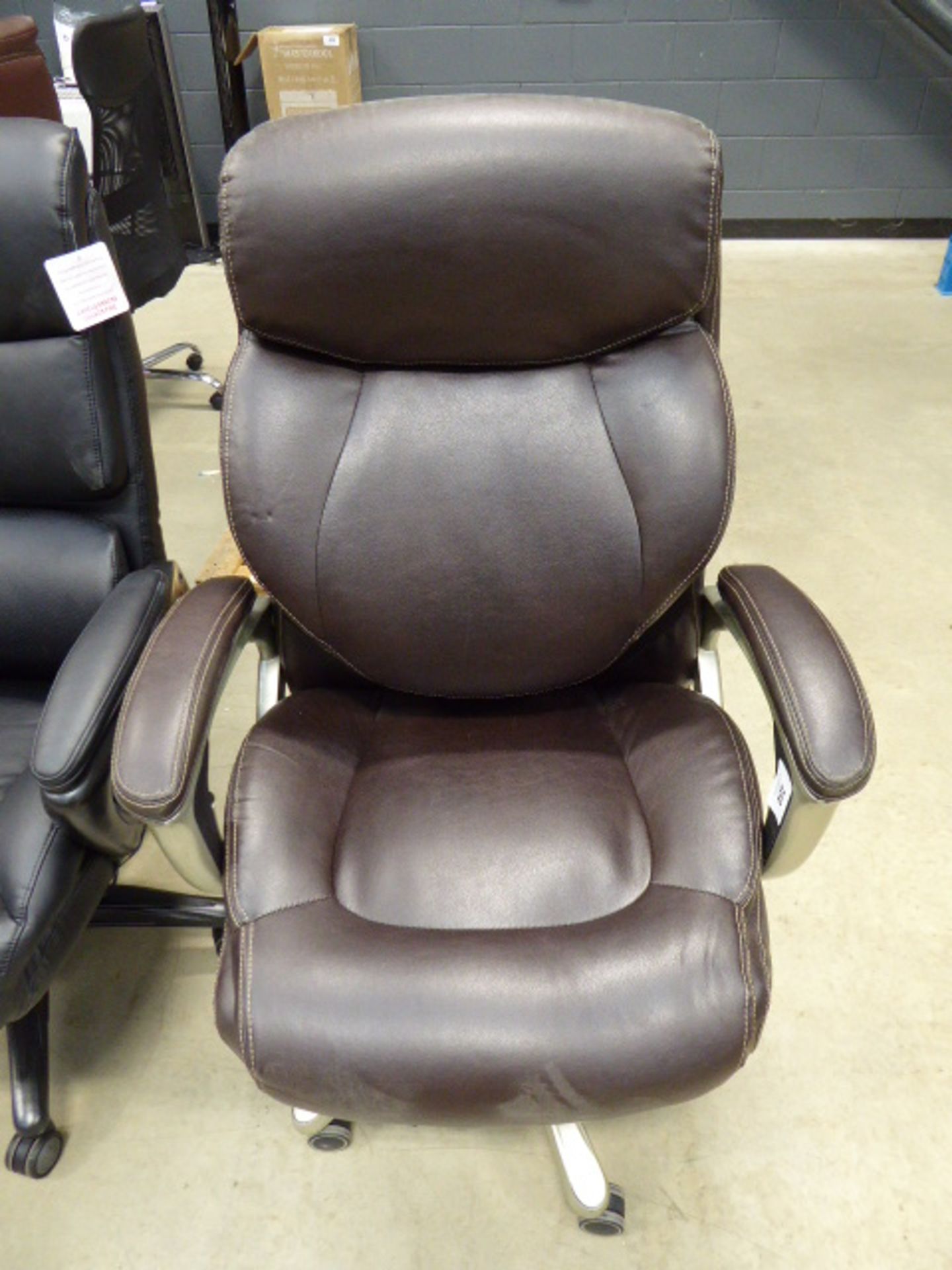 Brown highback executive style swivel armchair