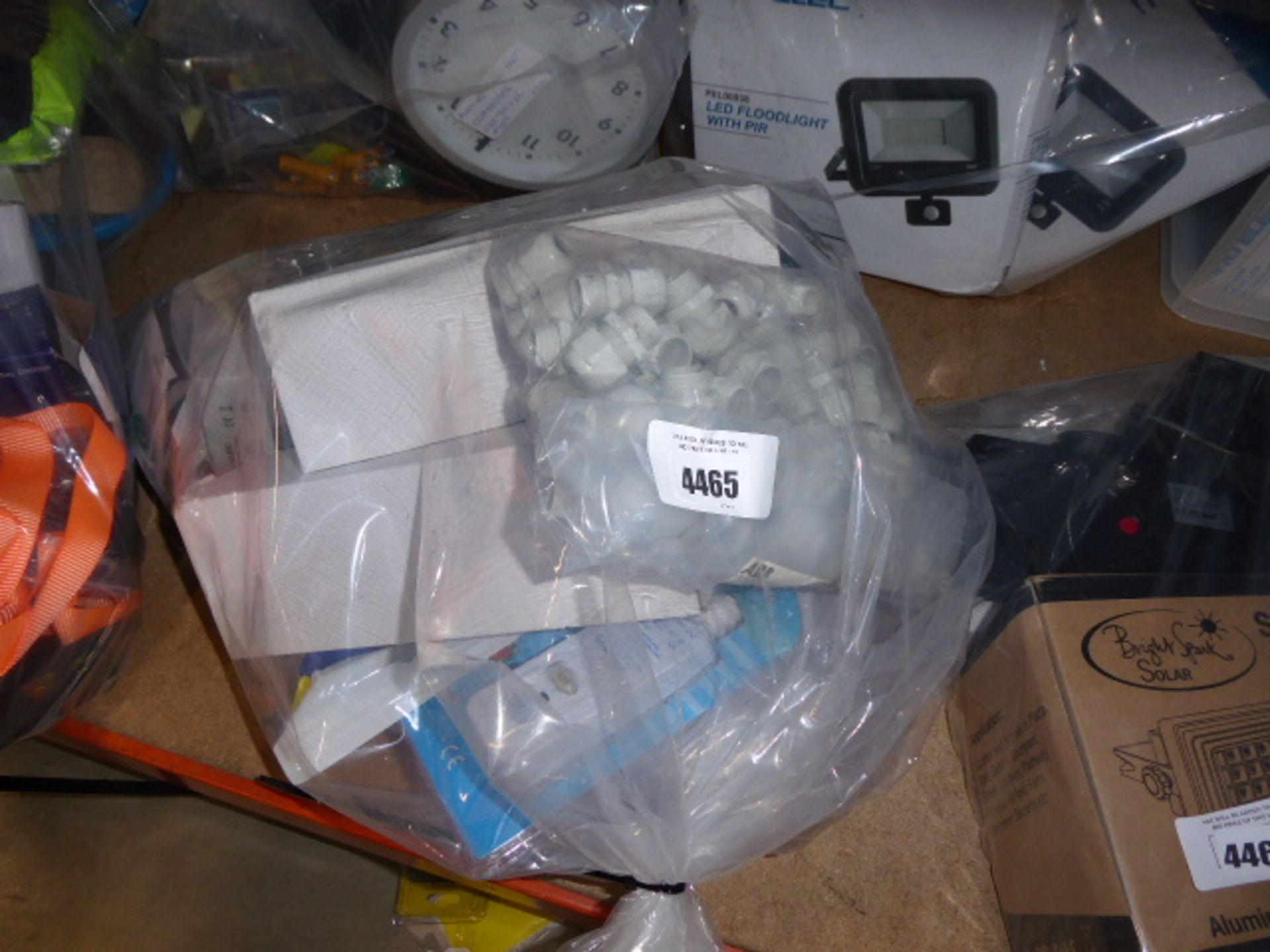 Bag of electrical items including outdoor sockets, switches, plugs, etc