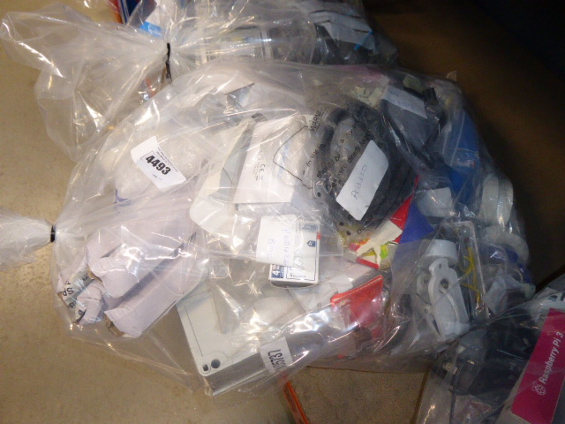 A bag containing: light tubes, switch boxes, electrical connectors, switches, tape etc