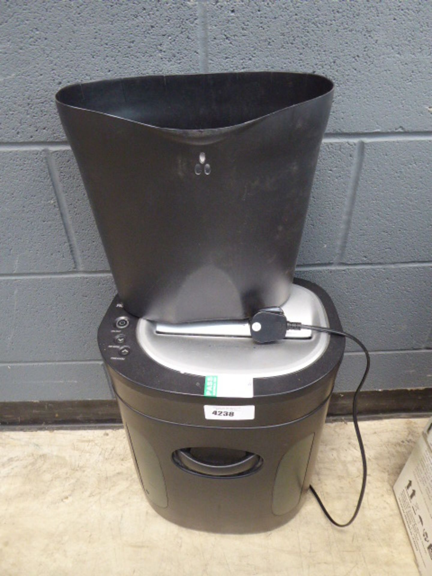 2 paper shredders and a cream foldup chair