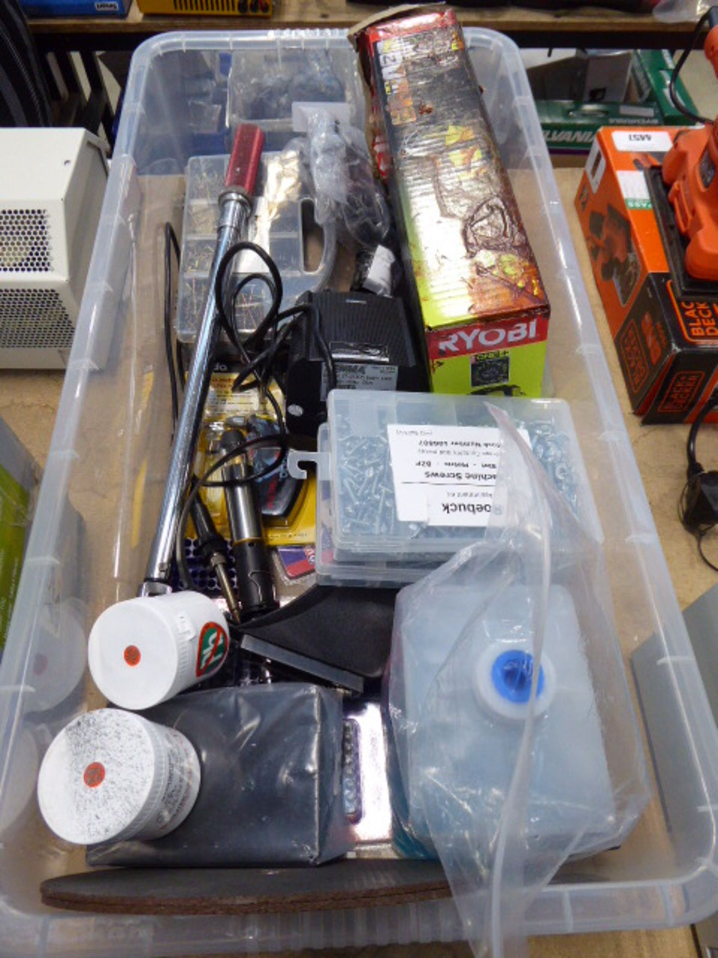 Large plastic box containing Ryobi bag, screws, blades, solder paste, soldering iron and other tools