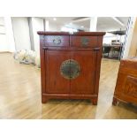 A late 20th century Oriental cabinet, two drawers over a pair of doors, painted red, w. 72 cm