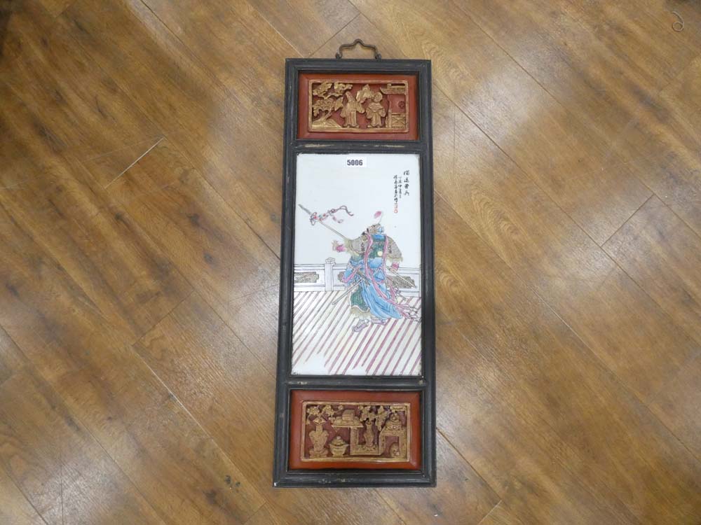 A late 20th century Oriental panel partially painted red and decorated with traditional figures,