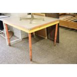 Industrial style metal framed mid century table with orange painted tubular legs