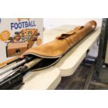 (1085) Leather fishing bag and contents of various fishing rods