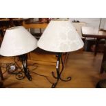 Modern pair of wrought metal table lamps with floral cream shades