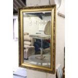 Rectangular gilt framed and bevelled wall mirror