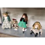 4 various collectors dolls