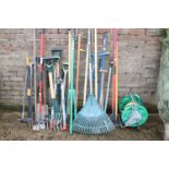 Collection of garden tools incl. hose, various forks, rakes, etc.