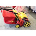 (1066) Wolf Garten electric lawn rake