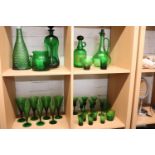 Quantity of green glassware incl. decanters, pourers and various glasses