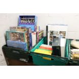 2 crates of puzzles and games incl. multiple packs of trivial pursuit