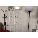 3 free standing hat and coat stands with floor standing uplighter