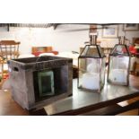 Pair of copper effect candle lanterns (1 AF) containing large candles with small wooden crate and