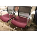 Pair of purple upholstered swivel office armchairs on 5 star chrome bases