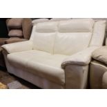 Cream leatherette upholstered 2 seater sofa