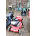 Petrol engine rotary lawn mower with small petrol can and some 4 stroke lawn mower oil