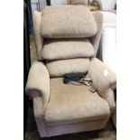 Brown upholstered electrically reclining easy chair