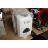 Boxed Gojo soap dispenser